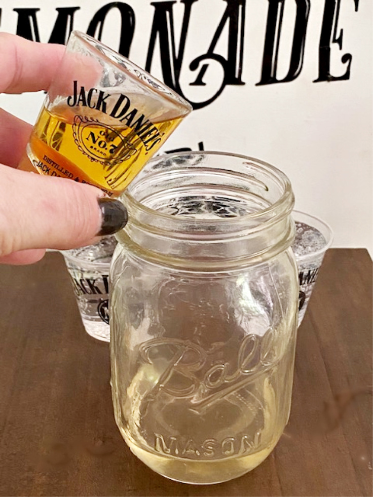 whiskey being poured in glass