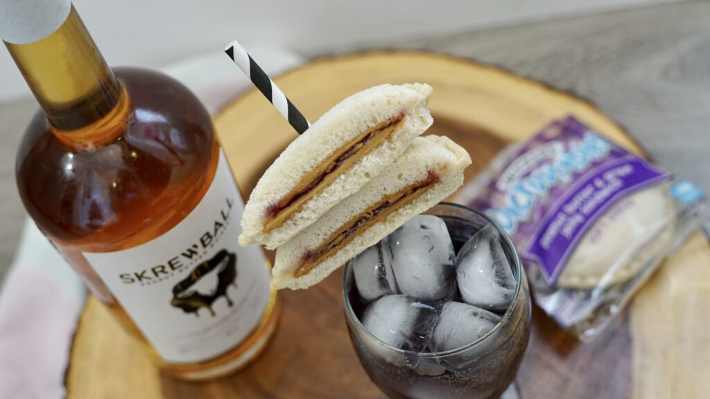 peanut butter & jelly whiskey cocktail with sandwich