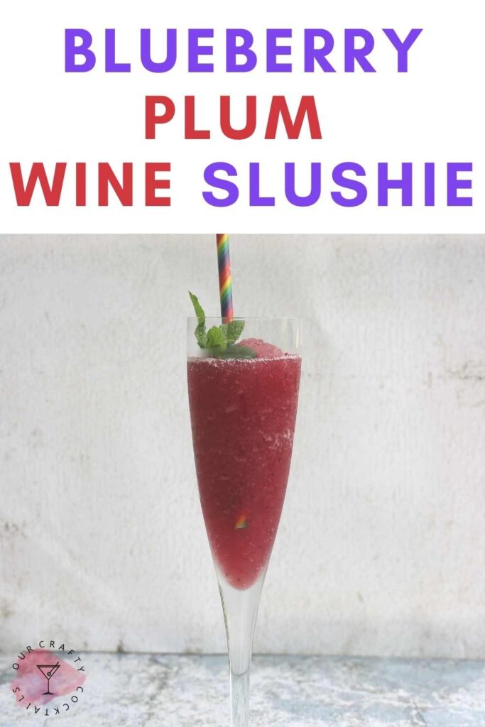 wine glass with blueberry plum wine slushie
