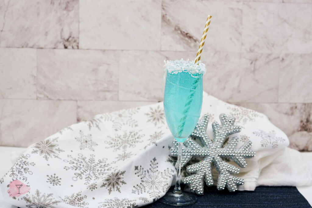 jack frost winter cocktail on counter with snowflake towel