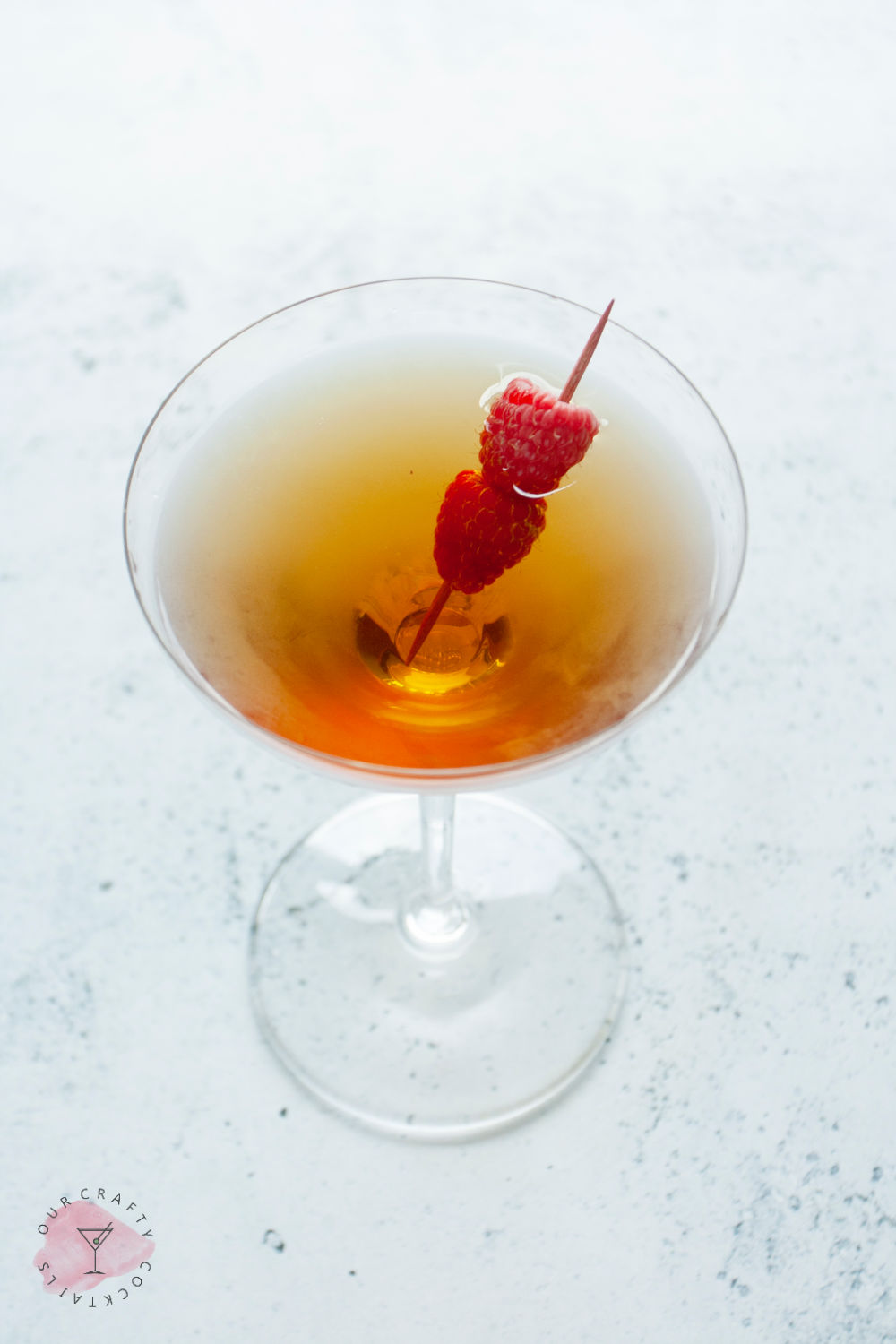 Sweet Vermouth Martini adding raspberries