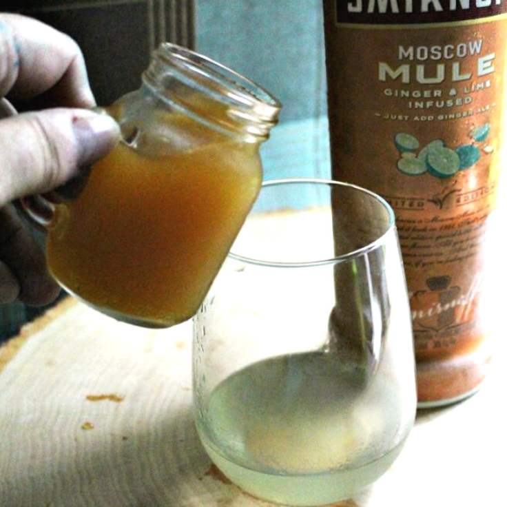 pouring apple cider in glass